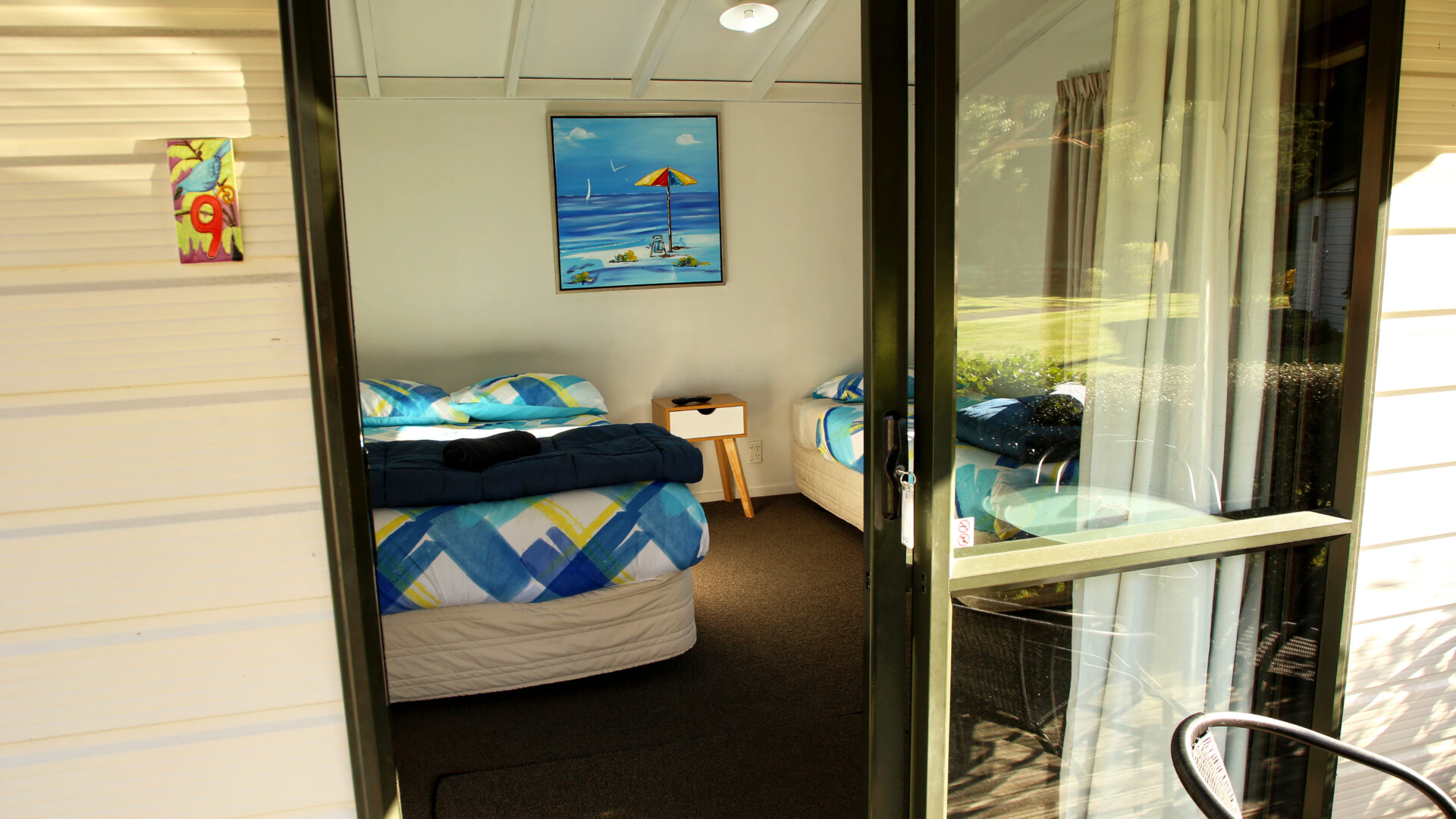Picton TOP 10 Holiday Park Standard 3-Person Cabin interior shot 1 Warm and inviting interior of Standard Cabin at Picton TOP 10 Holiday Park.