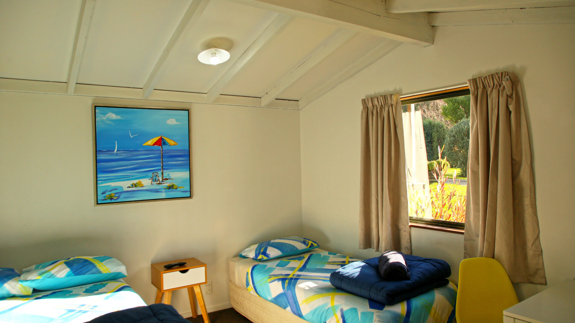Picton TOP 10 Holiday Park Standard 3-Person Cabin interior shot 2 Warm and inviting interior of Standard 3-person Cabin at Picton TOP 10 Holiday Park.