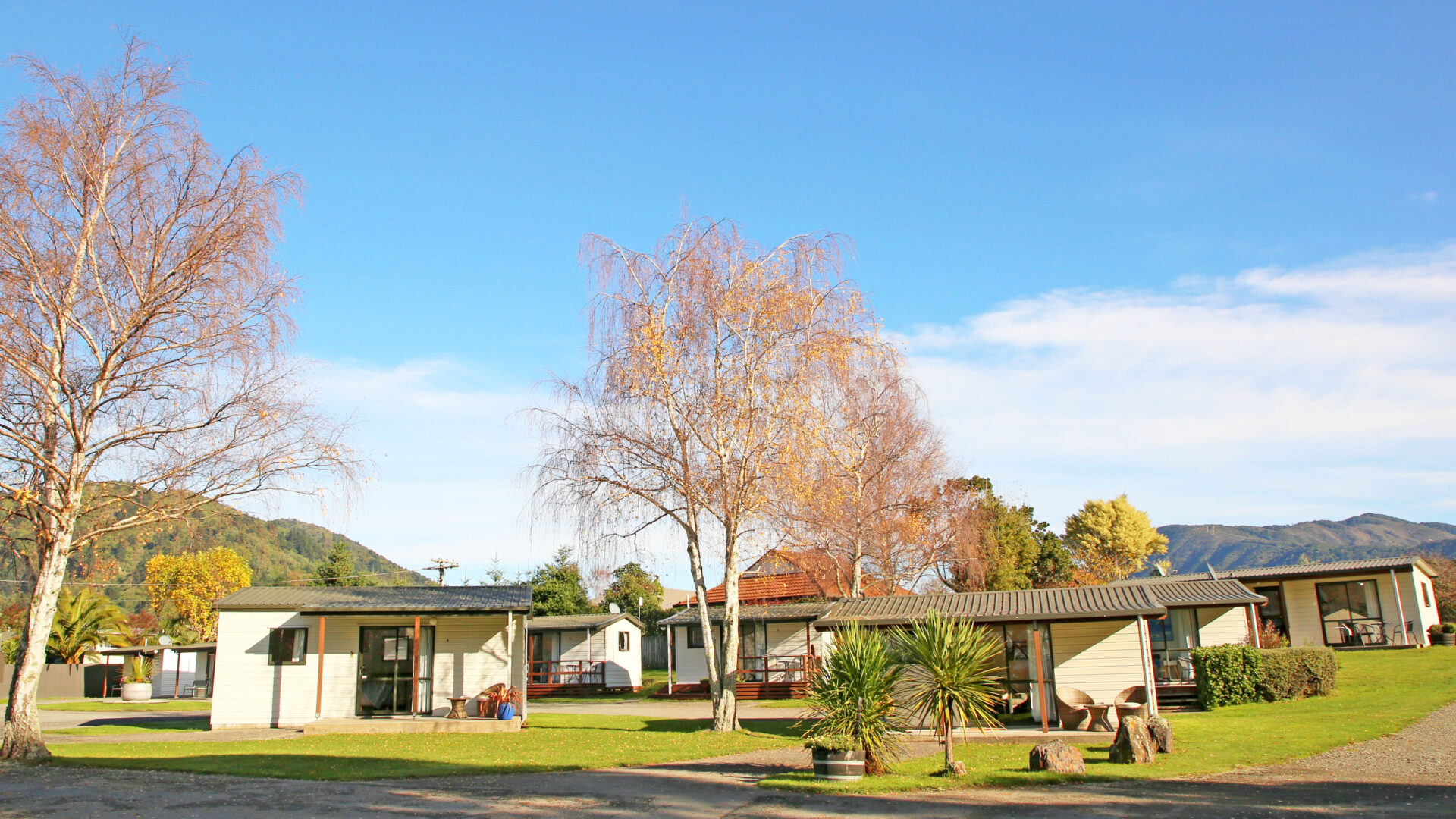 Picton TOP 10 Holiday Park Standard Cabin outside shot 3 Standard Cabins set amongst leafy grounds of Picton TOP 10 Holiday Park.